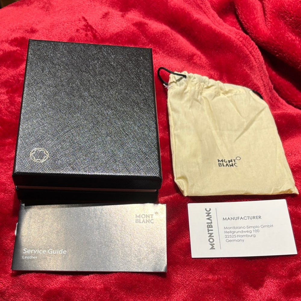 Montblanc Black Box with Beige Pouch- 6 inches by 4 3/4 inches. A unisex item
